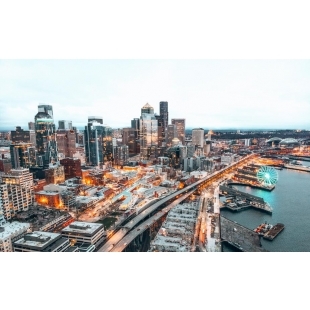 a-city-skyline-illuminated-as-the-sun-starts-to-set.jpg